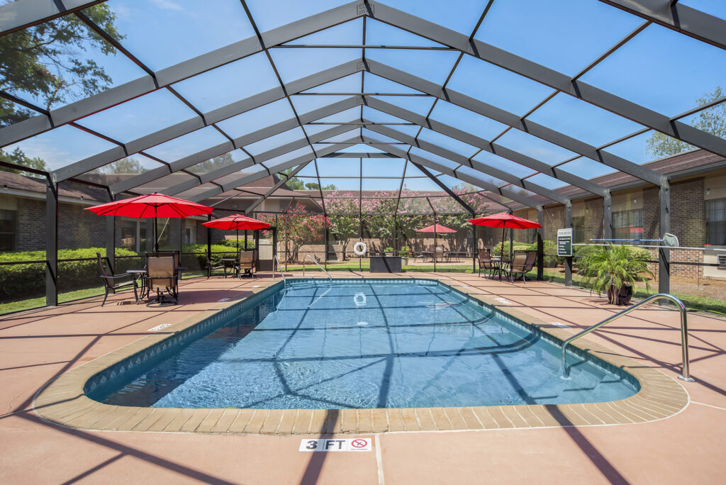 Outdoor pool and courtyard at Covenant Woods, a family-owned senior living community in Columbus, GA